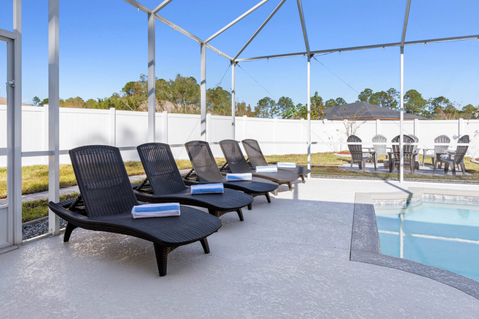 A group of lounge chairs in the sun.