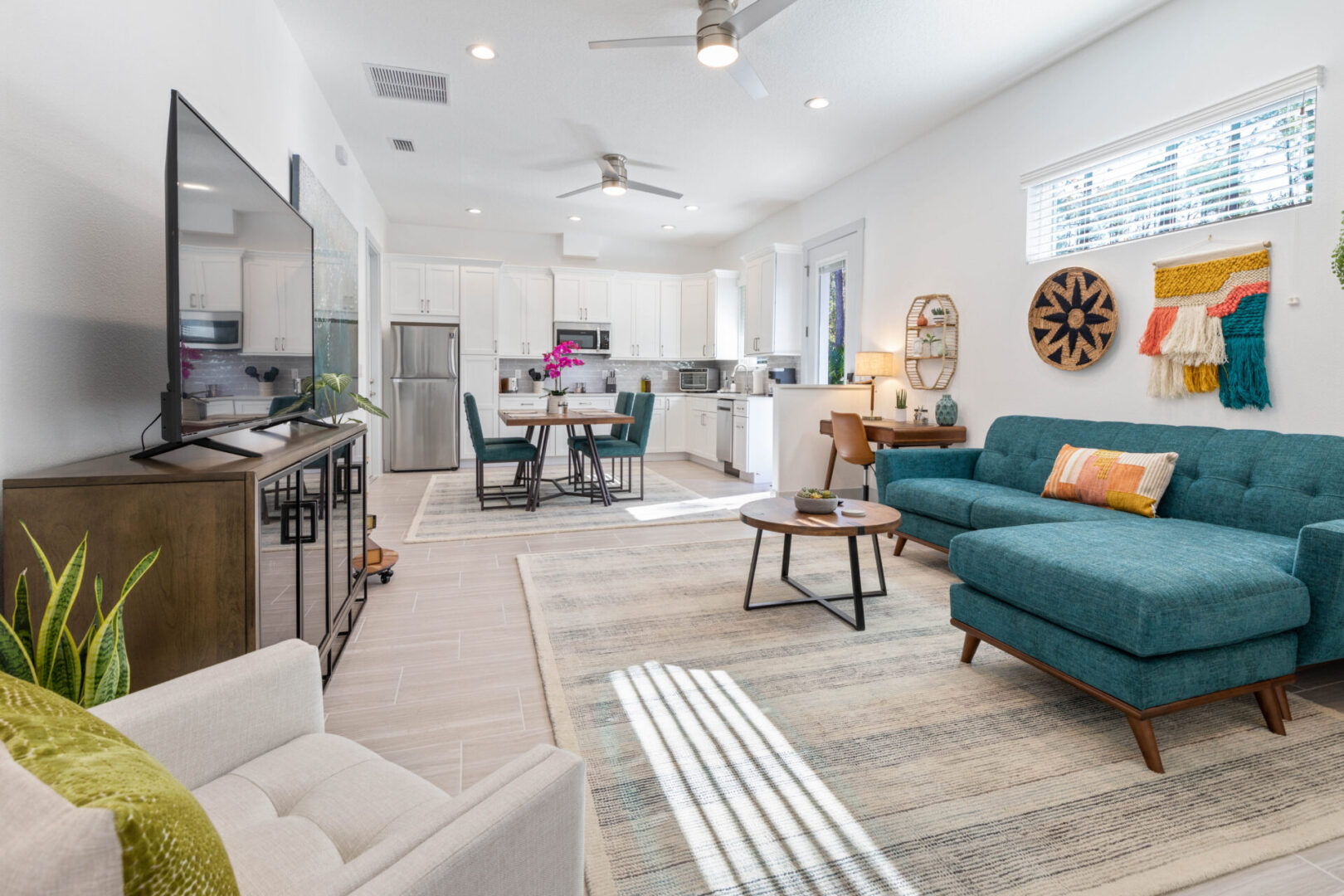 A living room with a couch and chairs